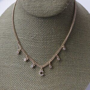 Women`s gold tone marked "whbm" letter C necklace.